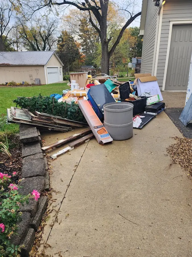 Dumpster being loaded with debris for Residential Dumpster Rental in Laplace